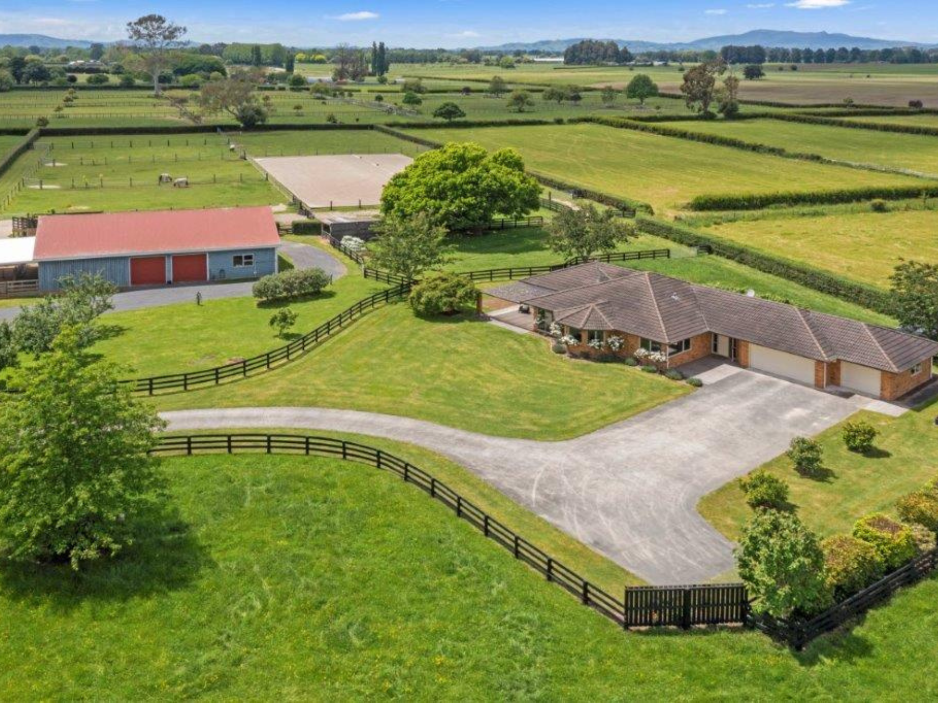 Aerial view of rural property with paddocks
