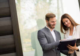 Property manager with client discussing portfolio