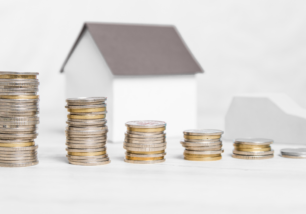 Money in front of a house